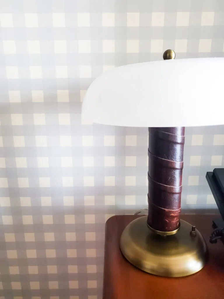 guest room graduate bloomington review, check wallpaper with leather desk lamp