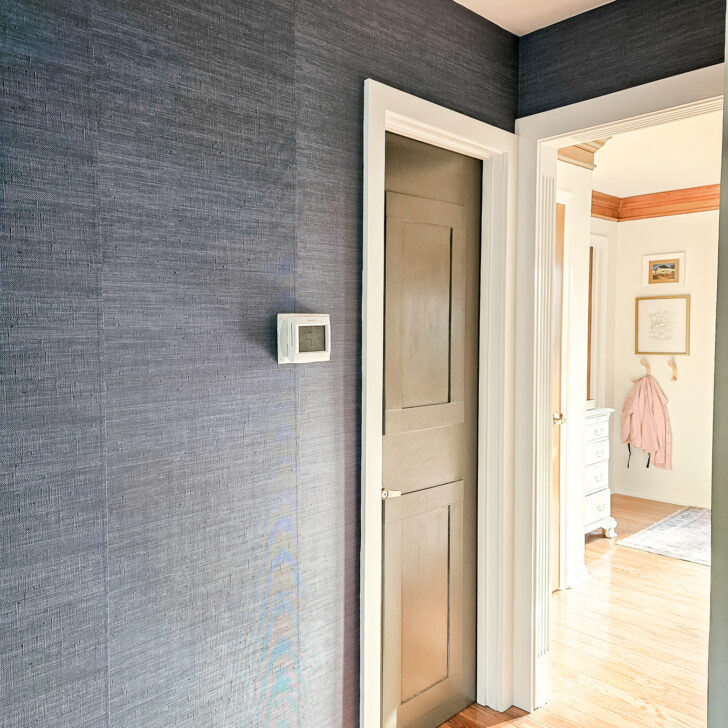 blue grasscloth accent wall, vinyl peel-and-stick faux grasscloth in a hallway