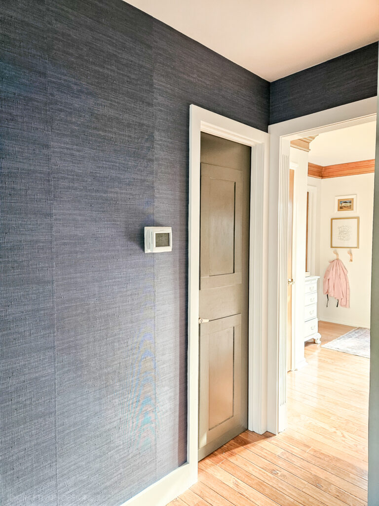blue grasscloth accent wall, vinyl peel-and-stick faux grasscloth in a hallway
