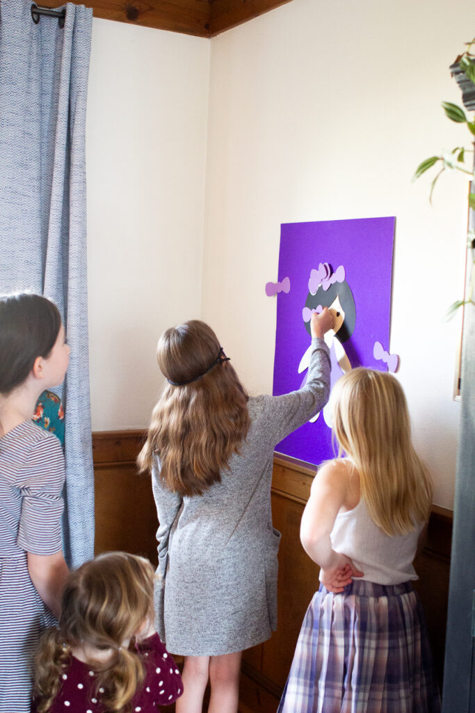 Kids playing Pin the Bow on the Doll